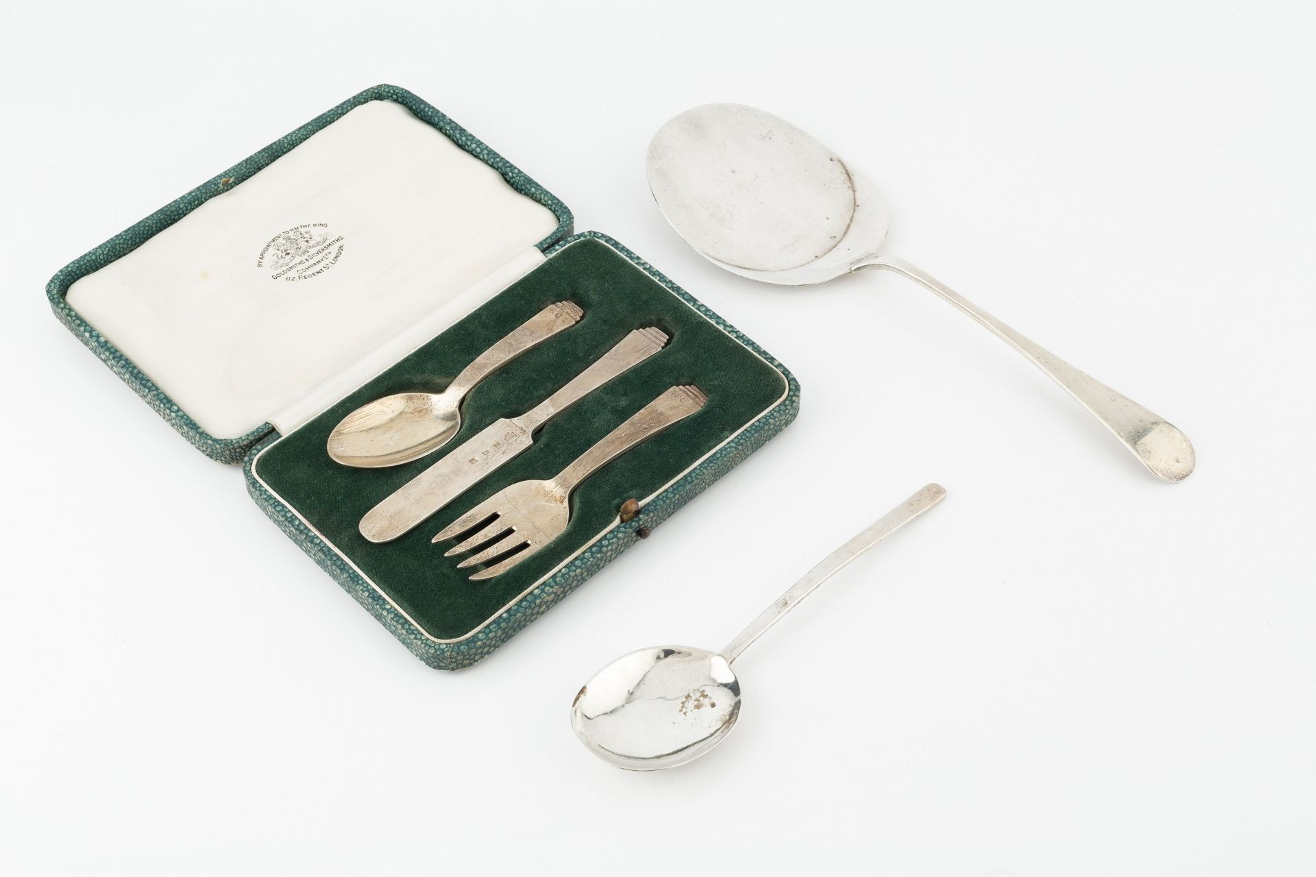 A silver old English pattern serving slice, by Asprey & Co. Ltd, London 1921, a silver three piece