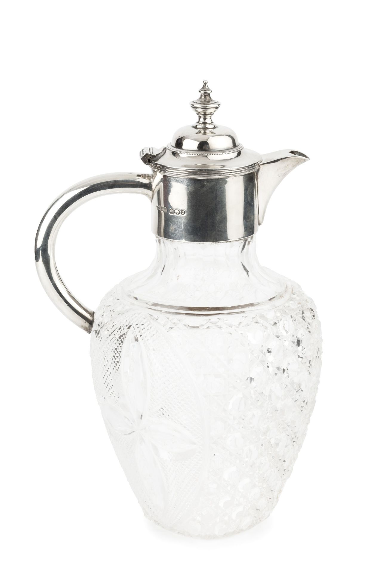 A late Victorian silver mounted cut glass claret jug, with hinged cover, plain curved handle and