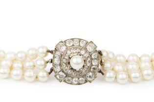 A cultured pearl three strand necklace with diamond clasp, the detachable circular clasp set with
