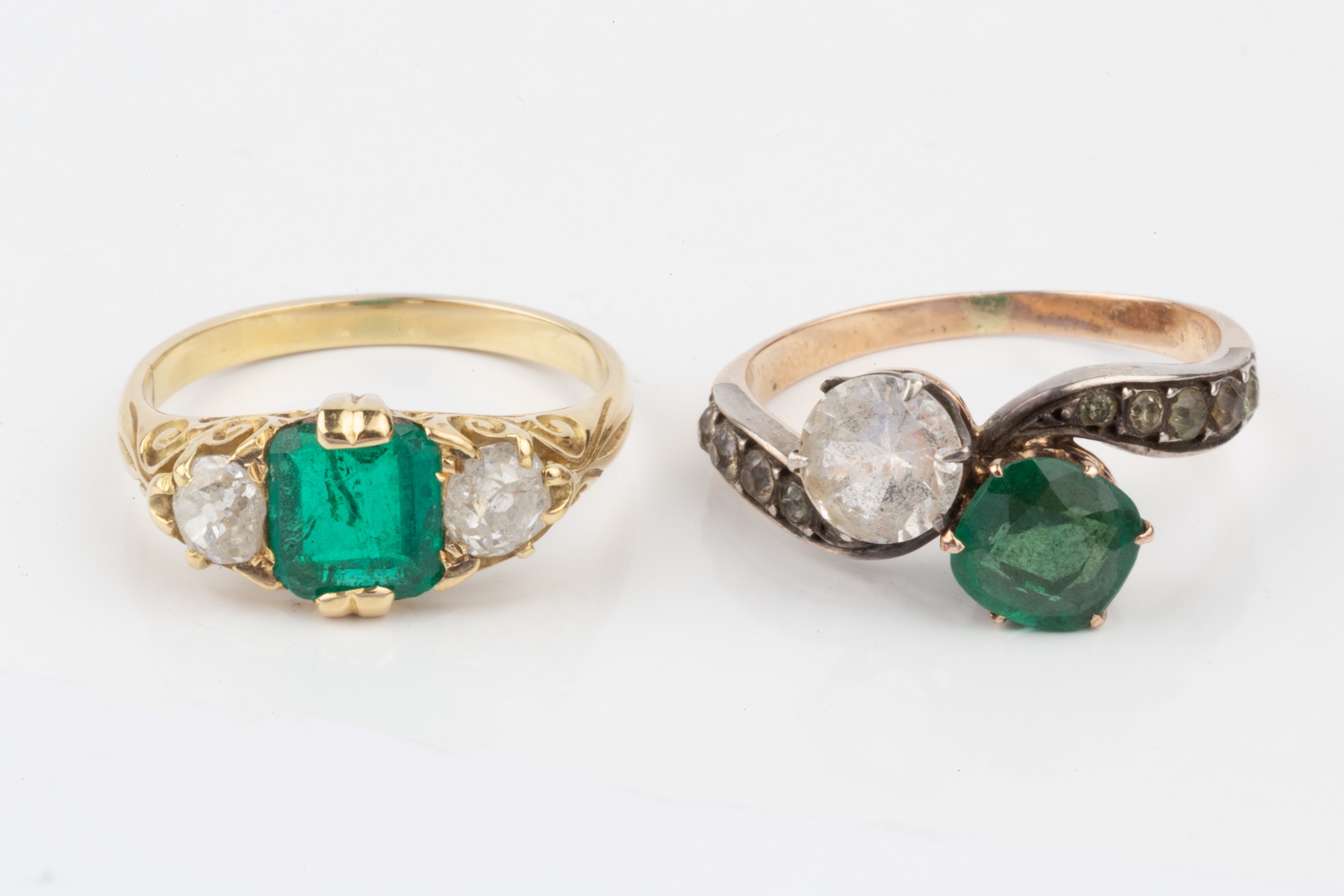 An emerald and diamond three stone ring, the square cushion cut stone flanked by old cut diamonds, - Image 4 of 4