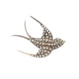 A 19th century diamond swallow brooch, set throughout with rose cut diamonds and with emerald set