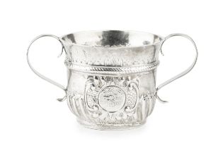 A George I Britannia standard silver small porringer, with ropetwist girdle and part lobed body,
