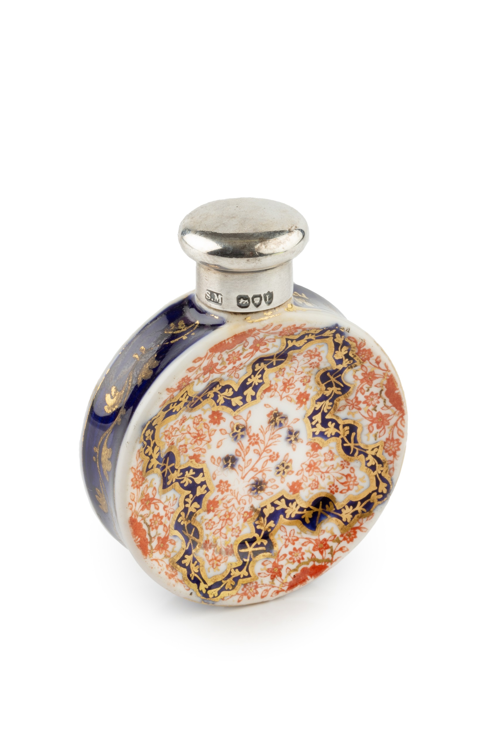 A late Victorian silver topped porcelain novelty scent bottle, in the form of an Imari dinner