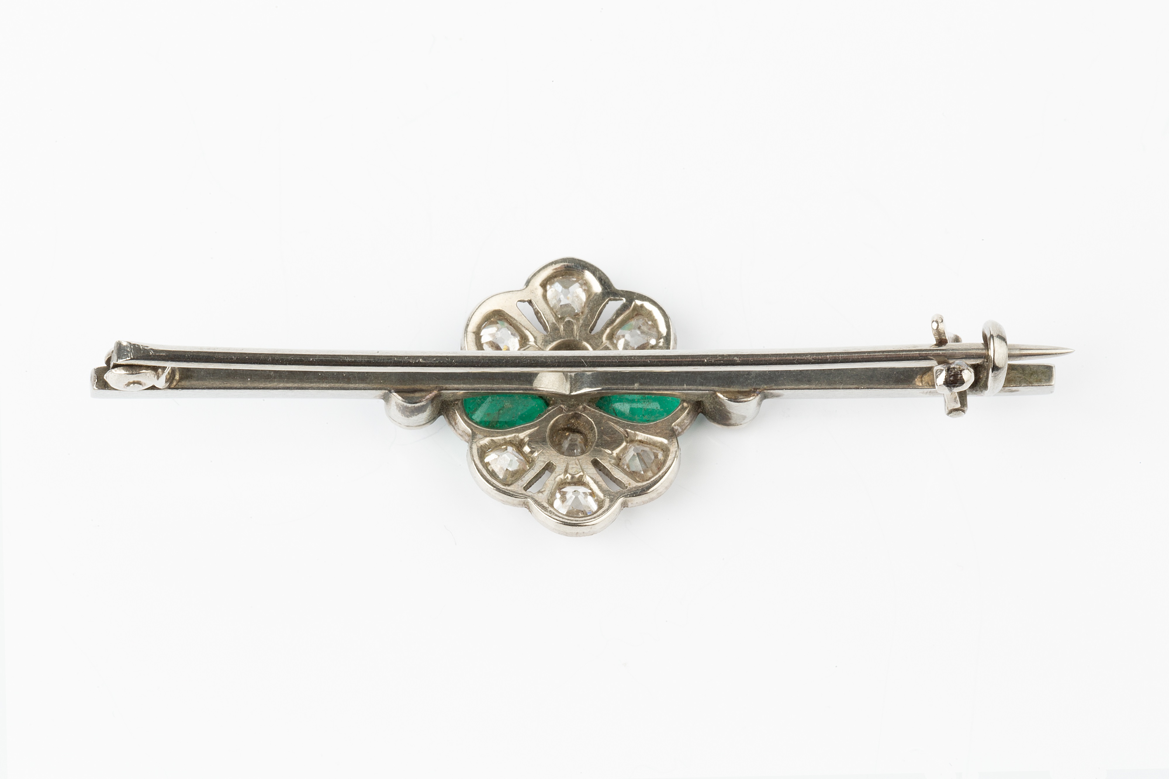 An emerald and diamond cluster bar brooch, the uniform bar centred with a pierced and millegrained - Image 4 of 6