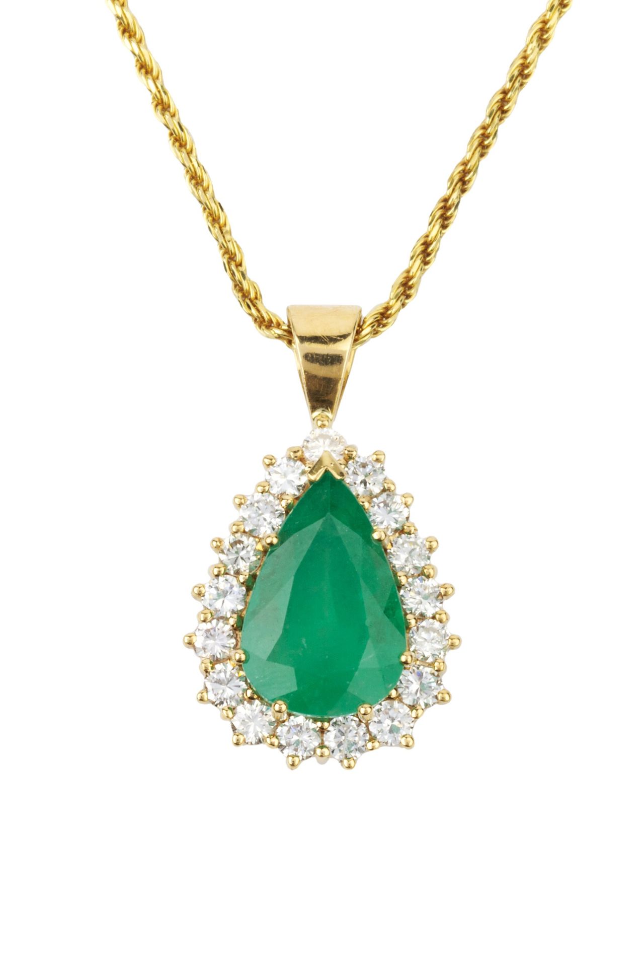 An emerald and diamond pendant, the mixed cut pear shaped emerald of 4.7ct within a border of