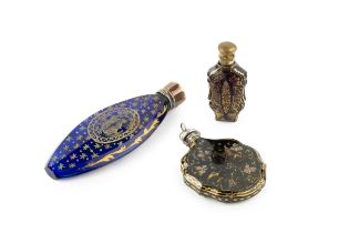 A 19th century French blue glass scent bottle, of flattened and faceted navette outline, decorated