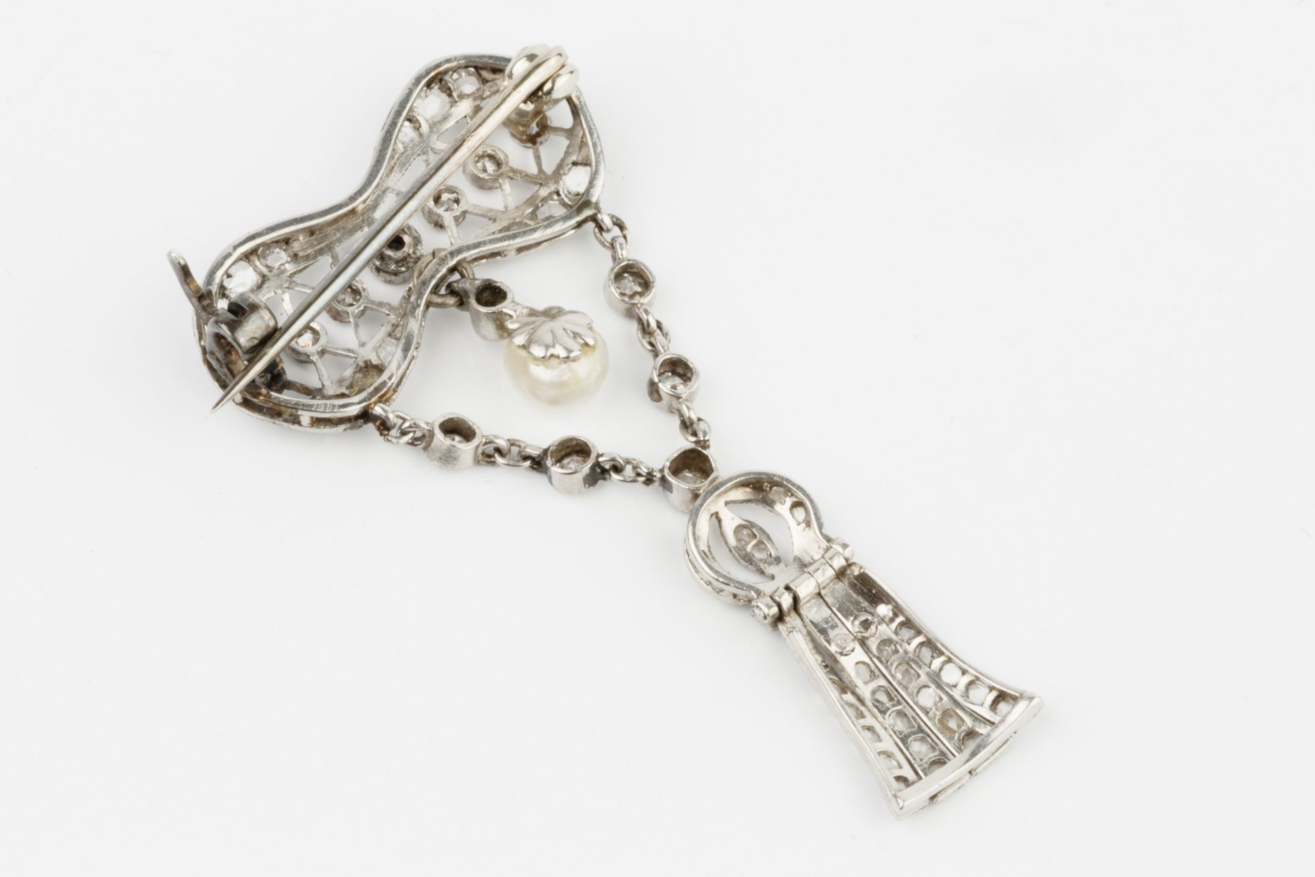 A diamond and pearl brooch, the shaped openwork panel suspending a single baroque pearl and tassel - Image 2 of 3
