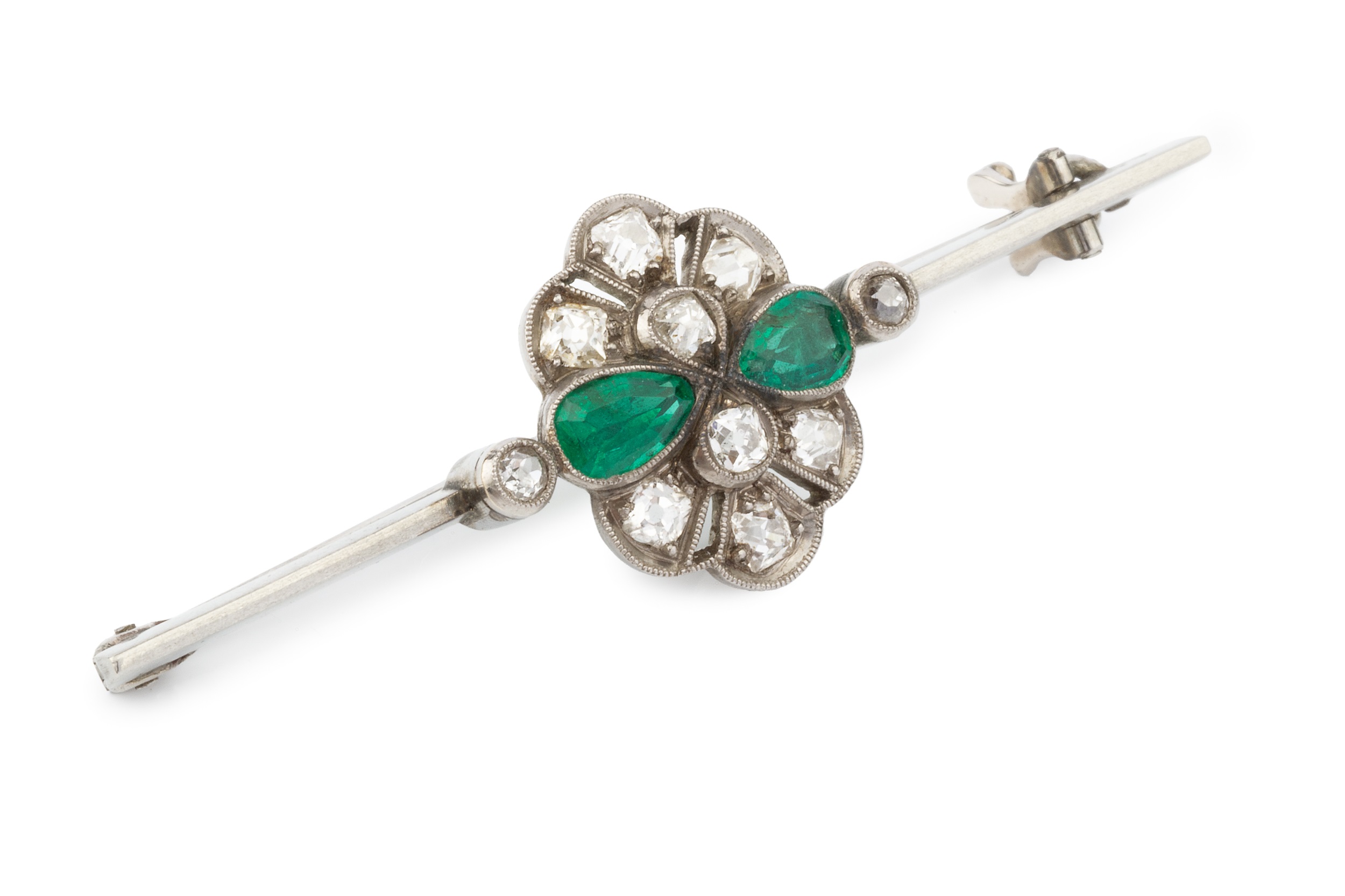 An emerald and diamond cluster bar brooch, the uniform bar centred with a pierced and millegrained