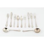A part service of silver flatware, with shaped handles comprising 4 table forks, 4 dessert forks,
