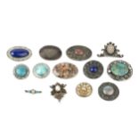 A collection of Arts and Crafts style brooches, to include a circular brooch with turquoise