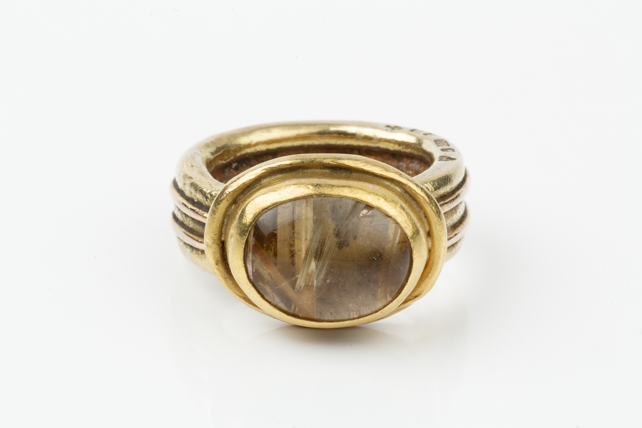 An 18ct gold and rutilated quartz set ring, the oval stone set in a heavy reeded setting and - Image 4 of 4