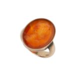 A 19th century carnelian seal ring, the oval carnelian plaque intaglio carved with a head and