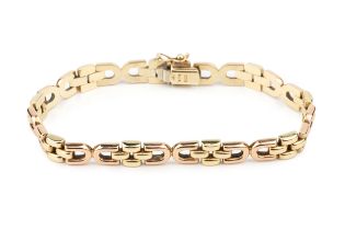 A 9ct two-colour gold bracelet, composed of D shaped and brick links, the clasps stamped 375, 18.5cm
