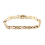 A 9ct two-colour gold bracelet, composed of D shaped and brick links, the clasps stamped 375, 18.5cm