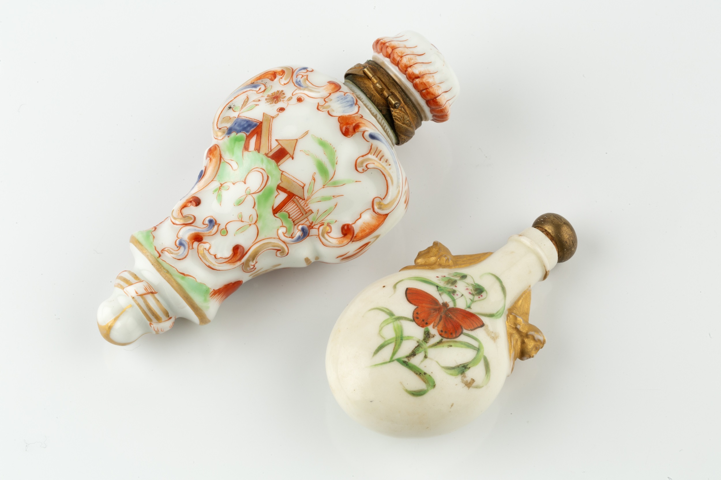 A late 19th century porcelain scent bottle, of oval flask form, painted to each side with a - Image 3 of 3