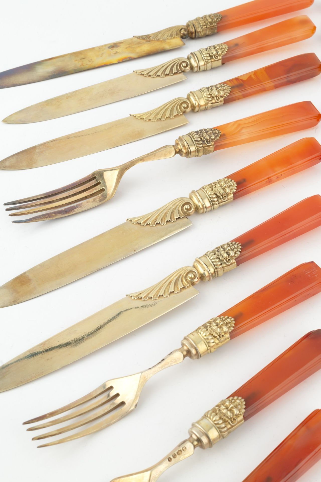 A set of twelve William IV silver-gilt and agate handled dessert knives and forks, with foliate - Image 3 of 3