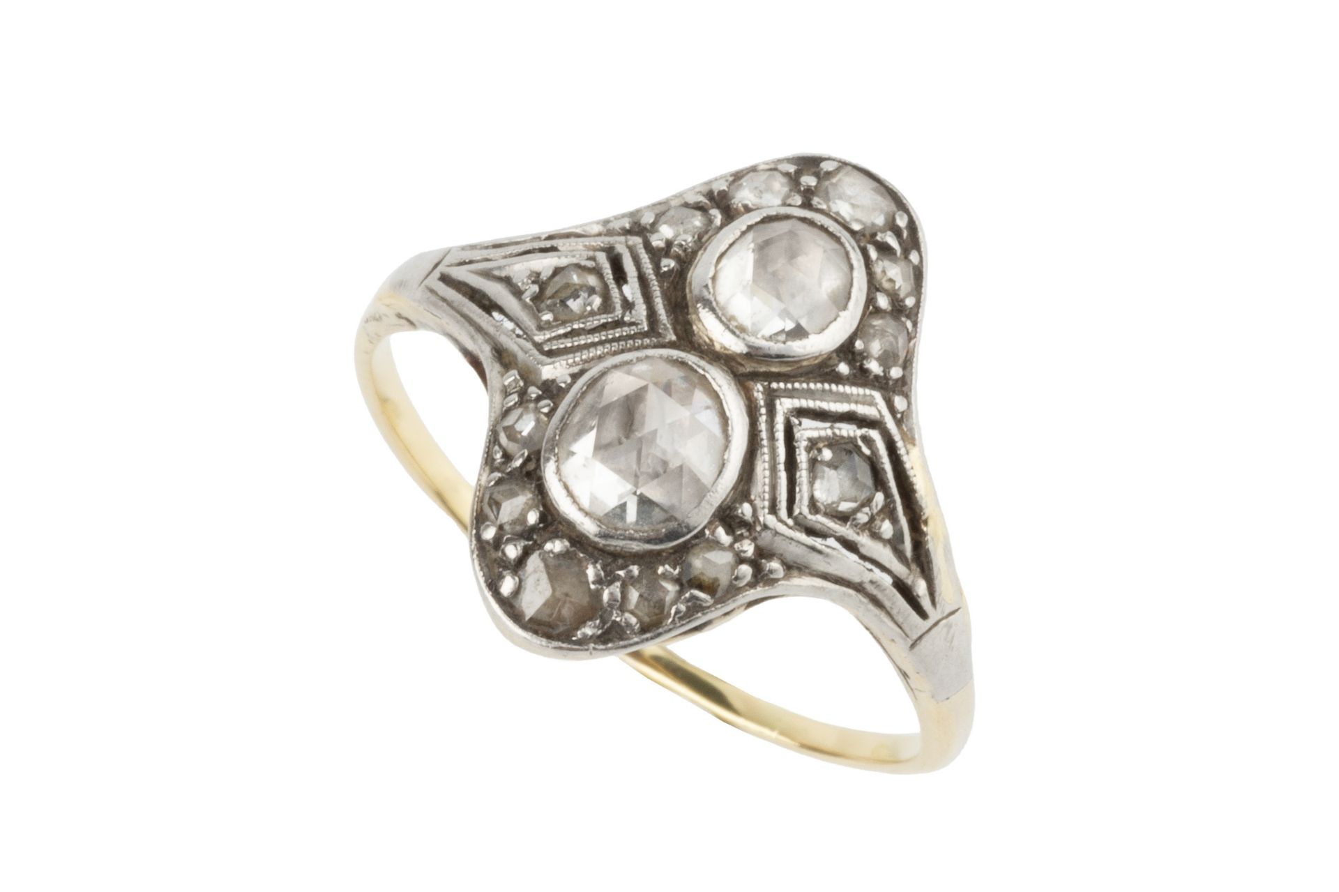 A diamond two stone ring, the two rose-cut stones set within a shaped border further set with