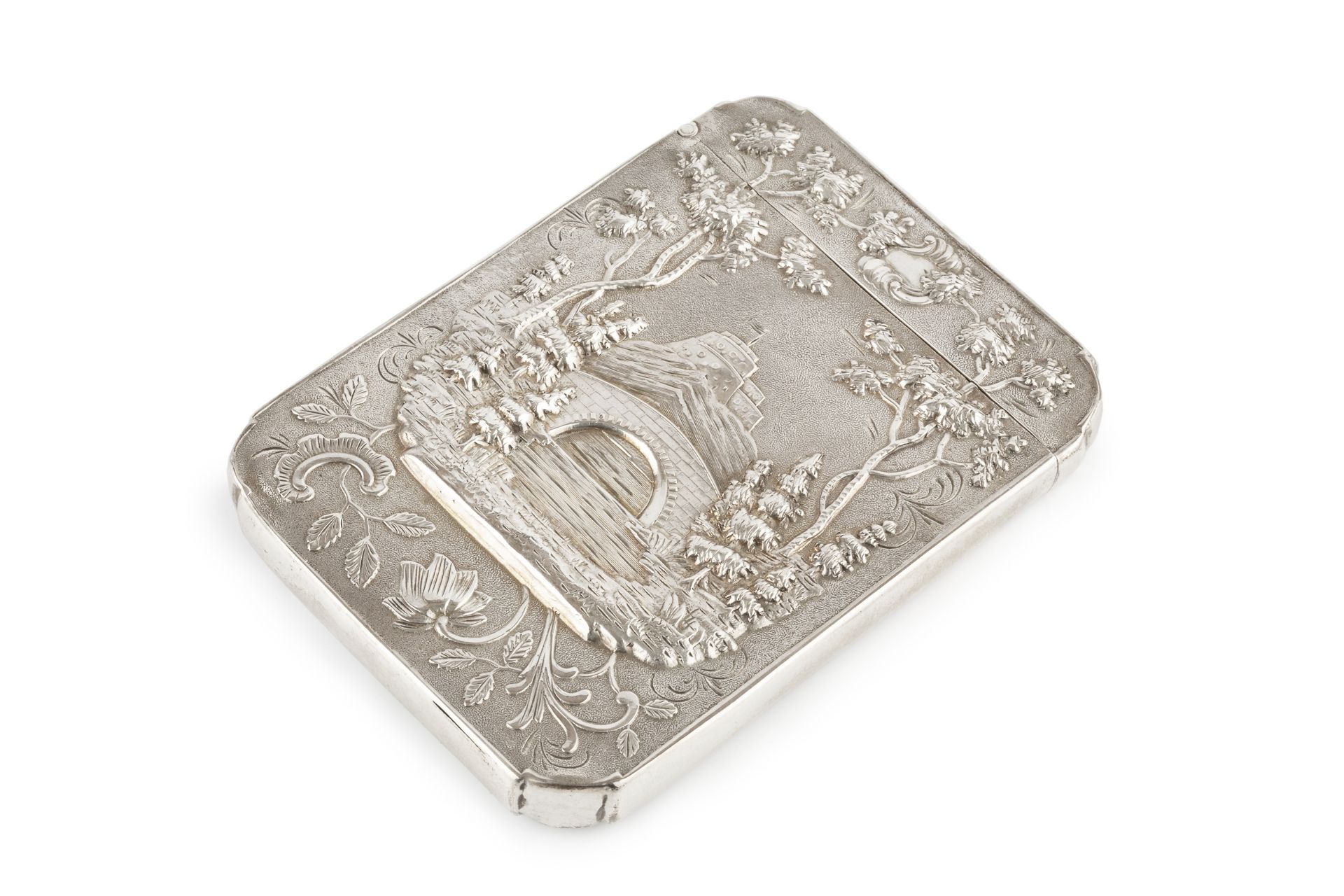 A 19th century silver castle top card case, possibly American, repoussé decorated to one side with a