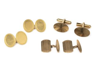 A pair of 18ct gold oval cufflinks, with engine turned borders, and two pairs of 9ct gold cufflinks.