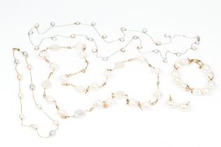 An 18ct gold and freshwater pearl necklace, the trace link chain interspersed with white, blush