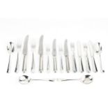 A service of silver Hanoverian pattern flatware, comprising 8 table forks, 8 dessert forks, 8