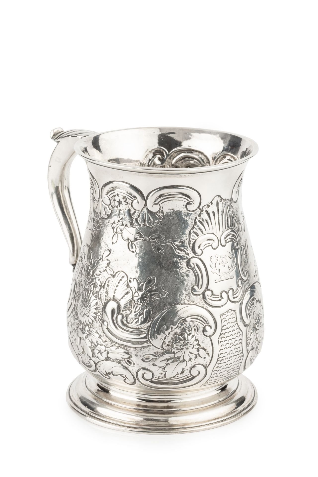 A George II silver pint mug, of baluster form, later embossed and engraved with flowering foliage