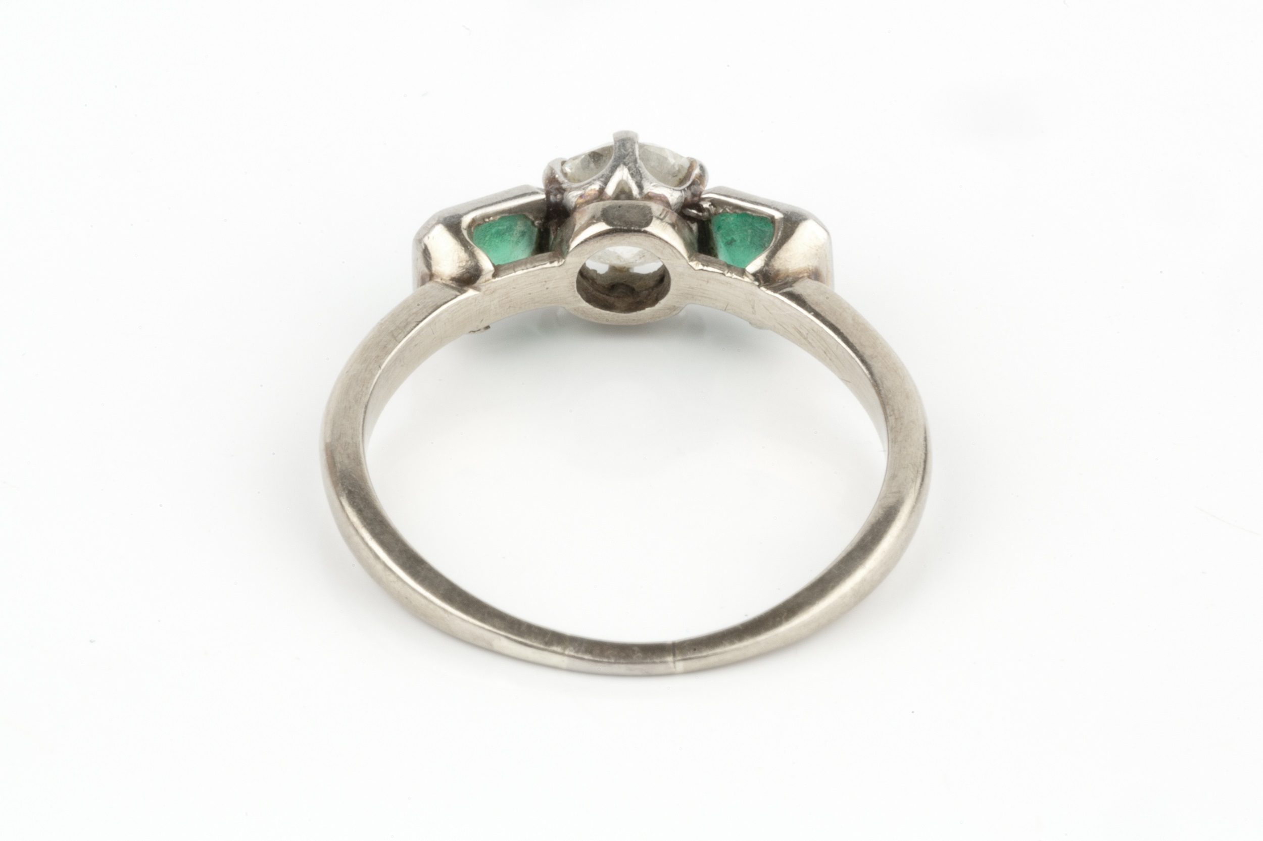 A diamond and emerald three stone ring, the central old-cut diamond in claw setting, between two - Image 4 of 4