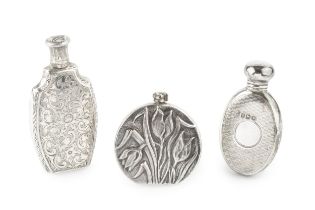 A modern silver scent bottle, of moon flask form, relief decorated with tulips and foliage by Ari D.