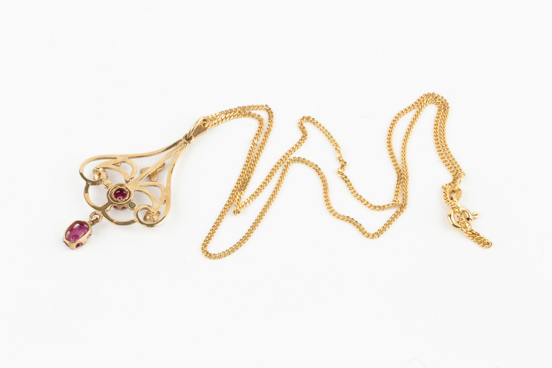 A 9ct gold, ruby and seed pearl pendant, of shaped openwork design, set with an oval cut ruby and - Bild 2 aus 4
