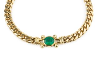 An 18ct gold and emerald necklace by Theo Fennell, of curb link design, with central oval collet-set