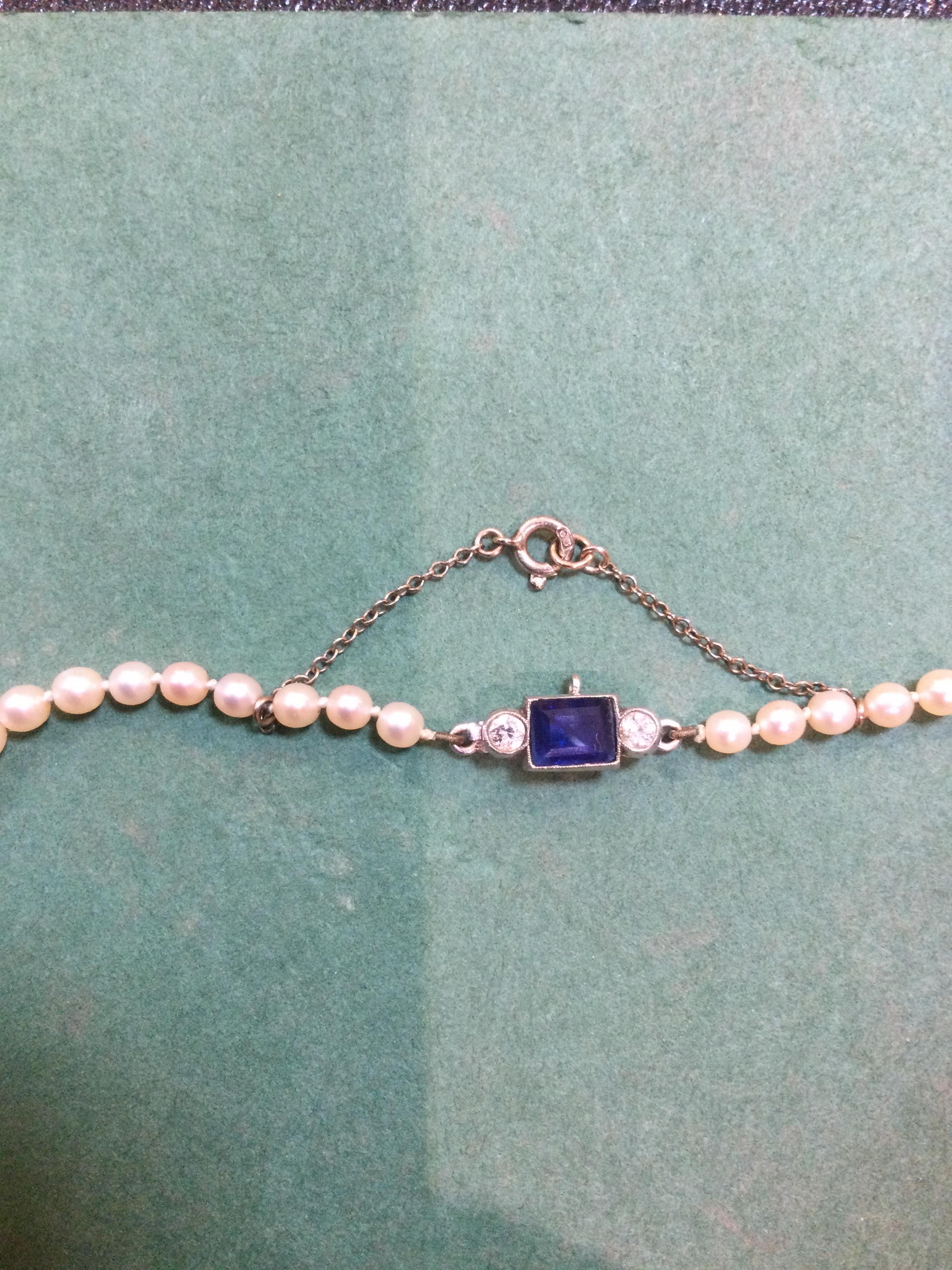 A single strand cultured pearl necklace, having sapphire and diamond set clasp centred with a - Image 6 of 6