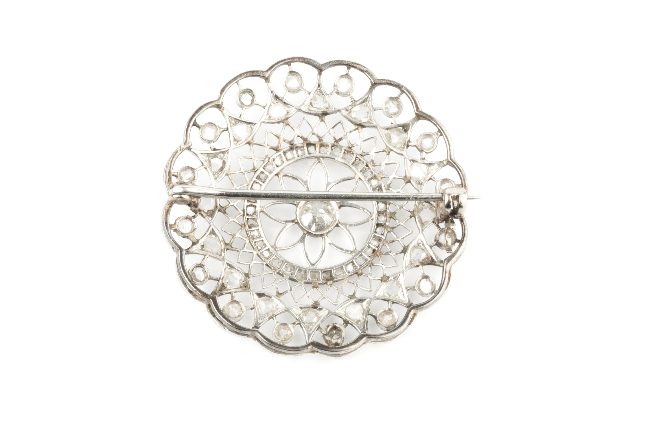 A diamond panel brooch, the circular openwork panel centred with an old brilliant-cut diamond in - Image 2 of 2