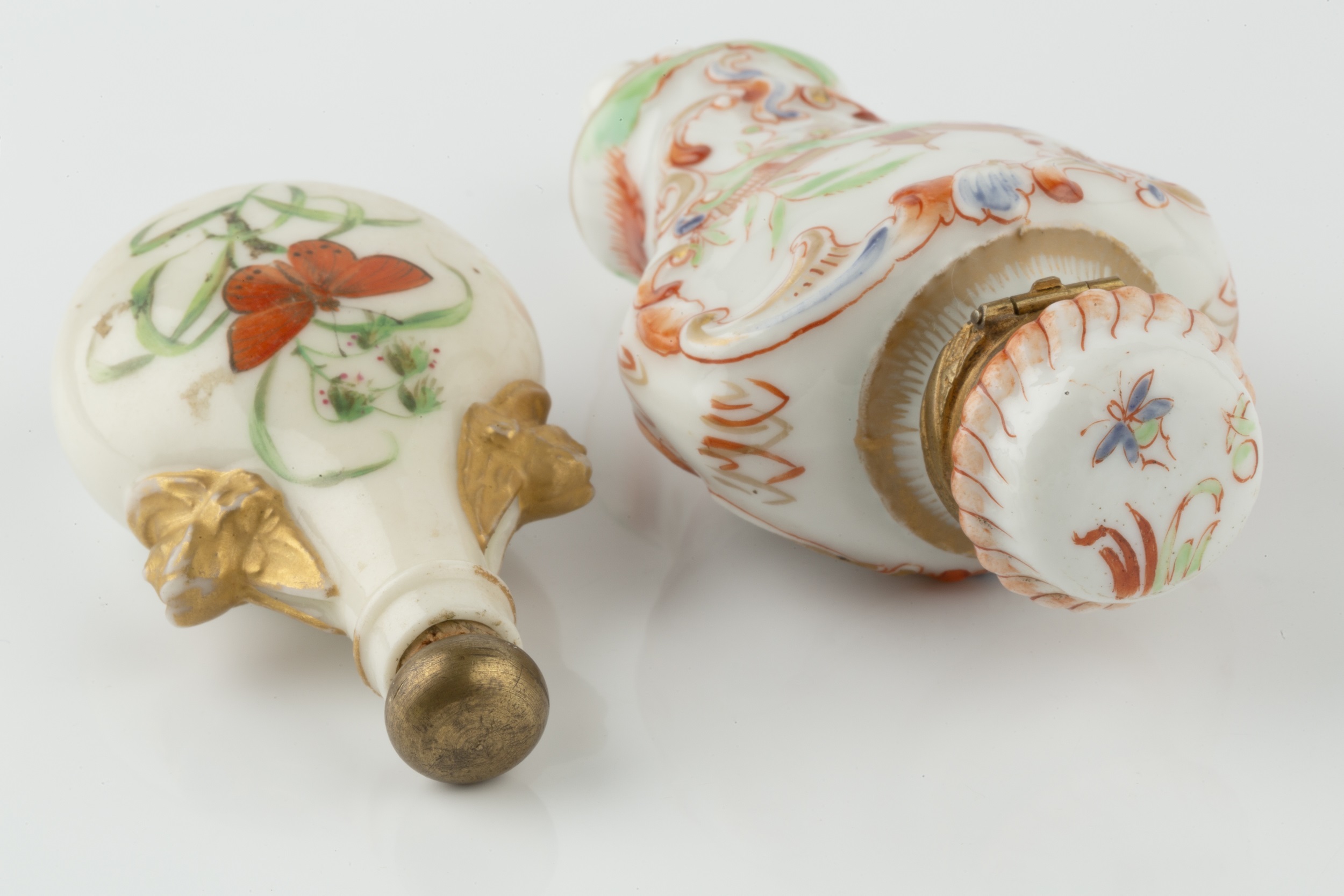 A late 19th century porcelain scent bottle, of oval flask form, painted to each side with a - Image 2 of 3