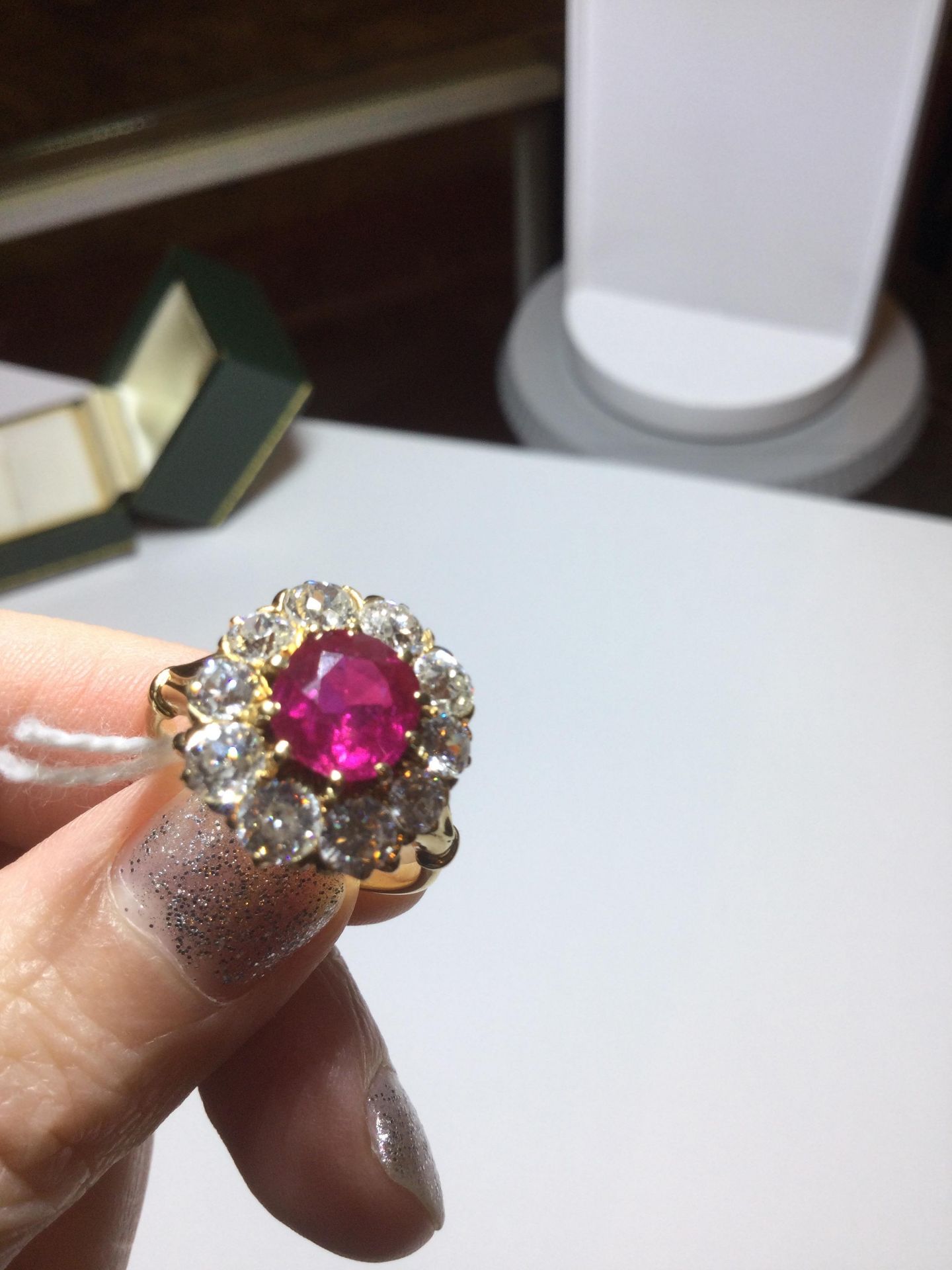 A ruby and diamond cluster ring, the central oval cut ruby within a border of ten old brilliant - Bild 11 aus 14