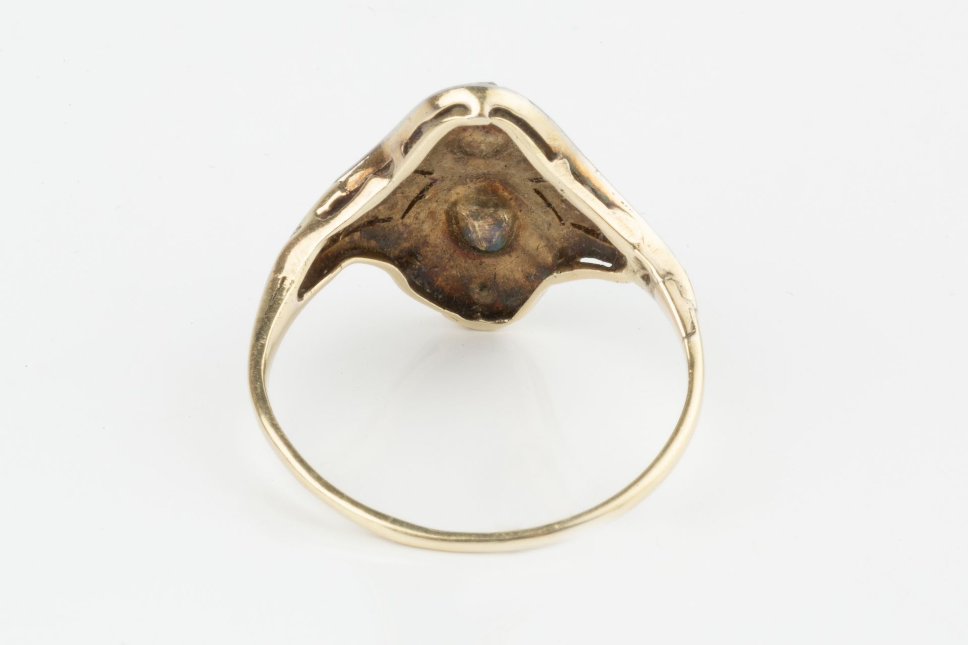 A diamond two stone ring, the two rose-cut stones set within a shaped border further set with - Image 2 of 4