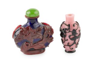 A Chinese red overlaid blue 'Peking' glass scent bottle, relief carved with flowering foliage and