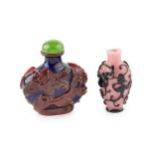 A Chinese red overlaid blue 'Peking' glass scent bottle, relief carved with flowering foliage and