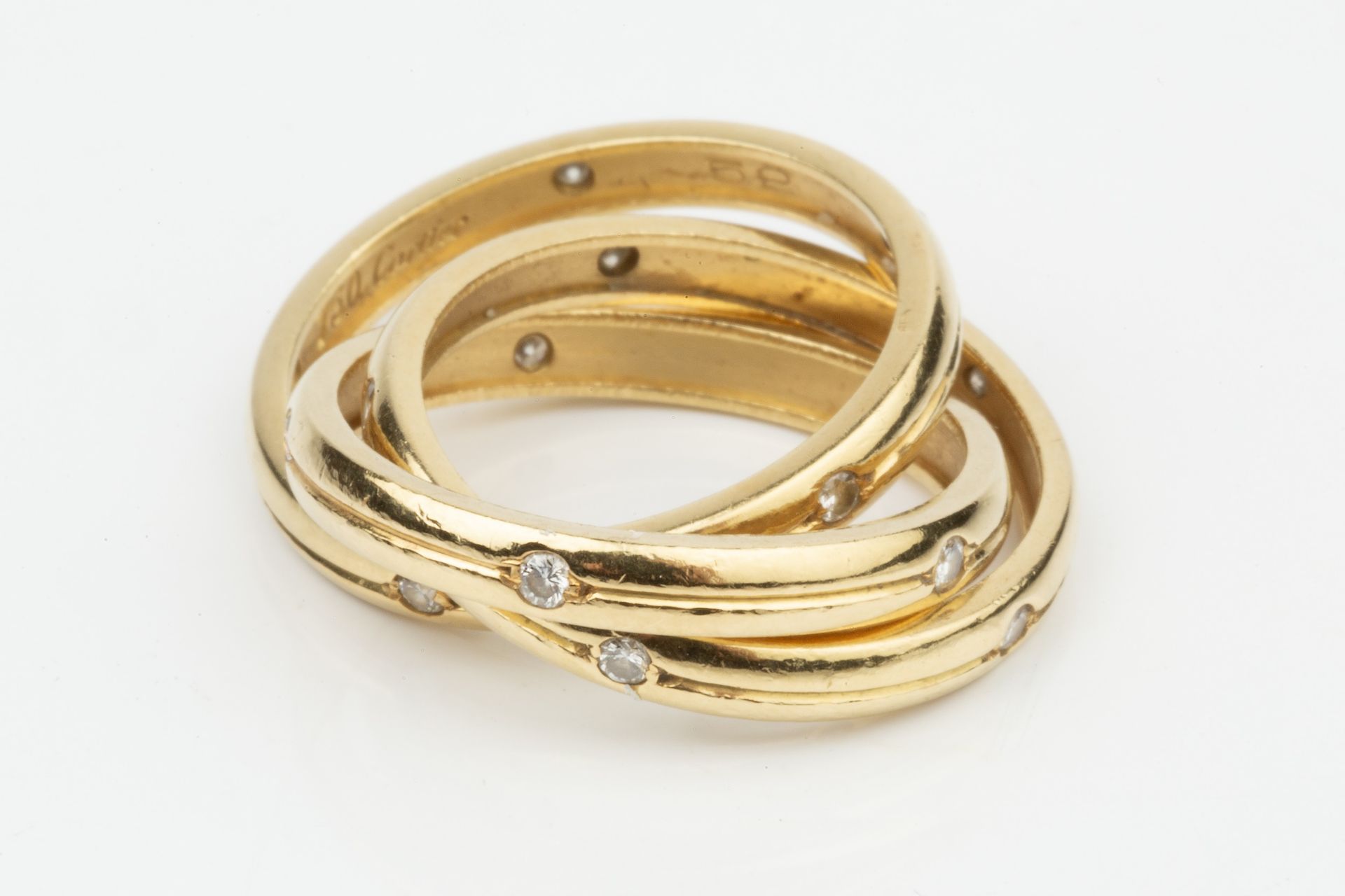 An 18ct gold and diamond 'Russian' wedding ring by Cartier, the three entwined bands each set with - Bild 4 aus 5