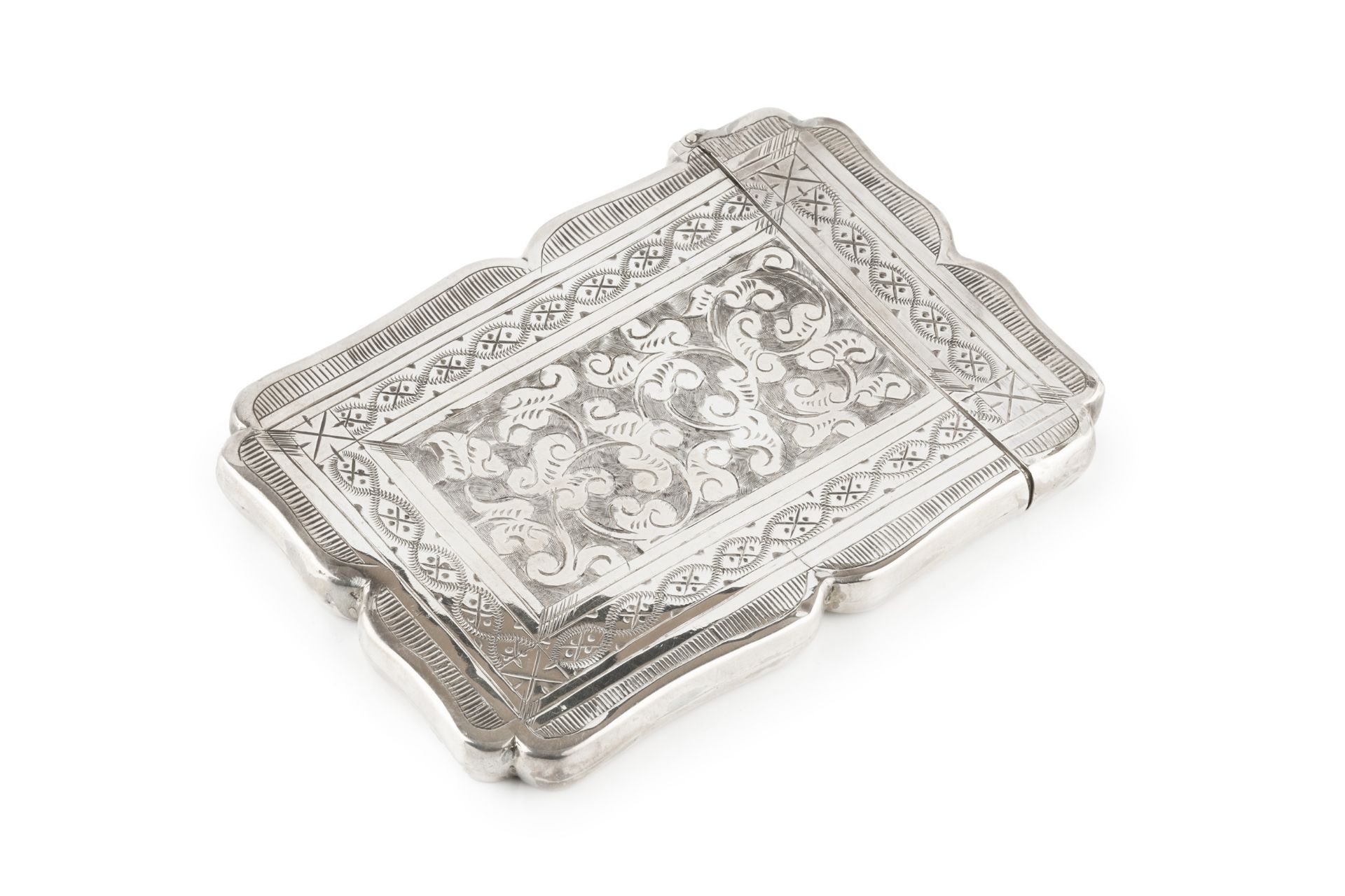 A late Victorian silver card case, of shaped rectangular outline, engraved with stylised scrolling - Bild 2 aus 3