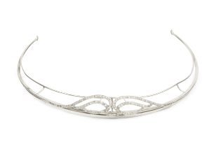 A diamond set tiara, of shaped and curved openwork design, set with old cut stones within millegrain