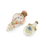 A late 19th century porcelain scent bottle, of oval flask form, painted to each side with a