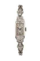 A diamond cocktail watch, of Art Deco design, having rectangular silvered dial and stepped diamond