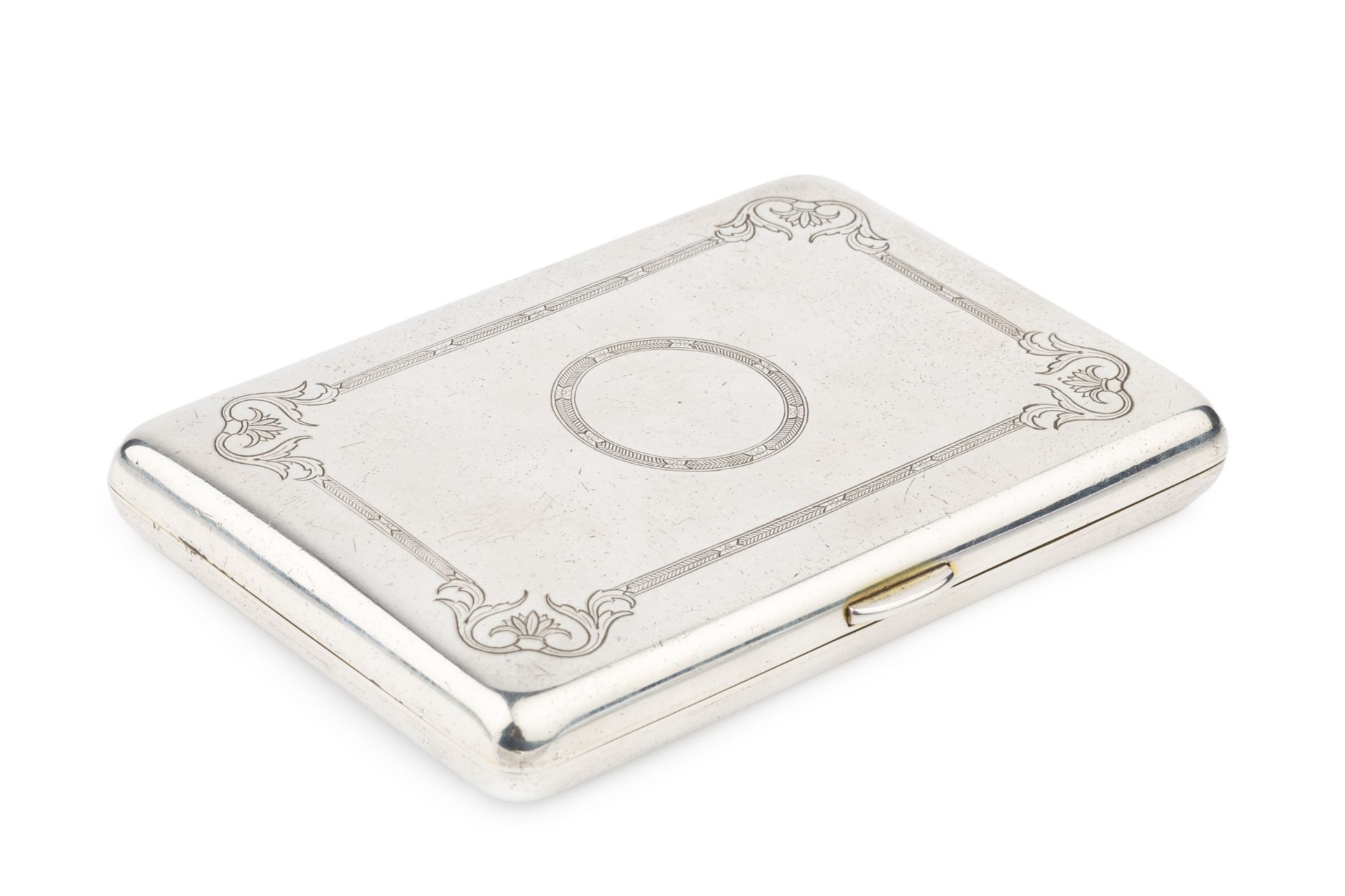 An Edwardian silver rectangular card case, with engraved decoration, rounded corners and sprung