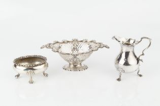 A George II silver cream jug, of baluster form with scroll handle and pad feet, by George Hindmarsh,