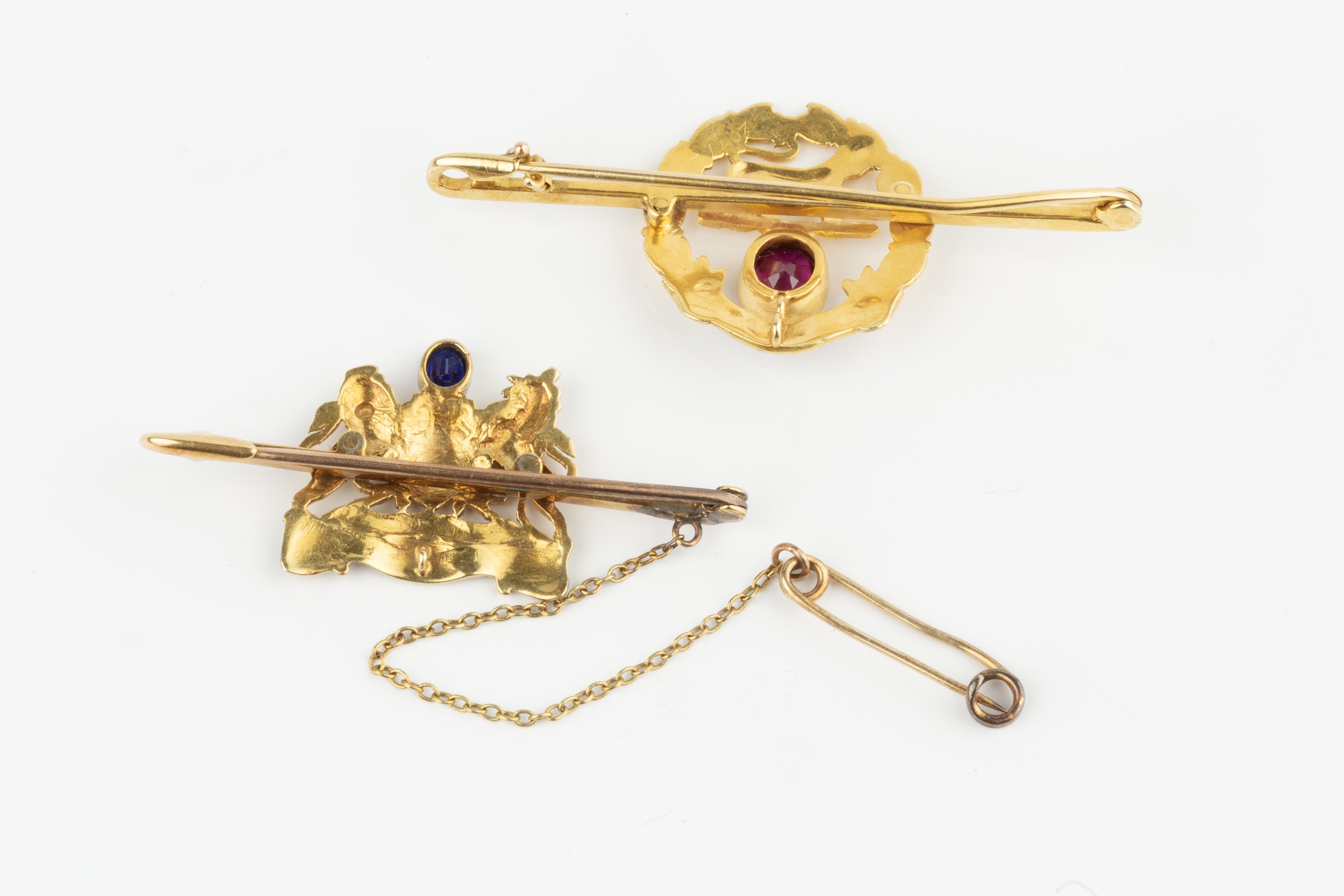 A 15ct gold, enamel and gem set regimental brooch, for the Hampshire regiment, of wreath design with - Image 2 of 2