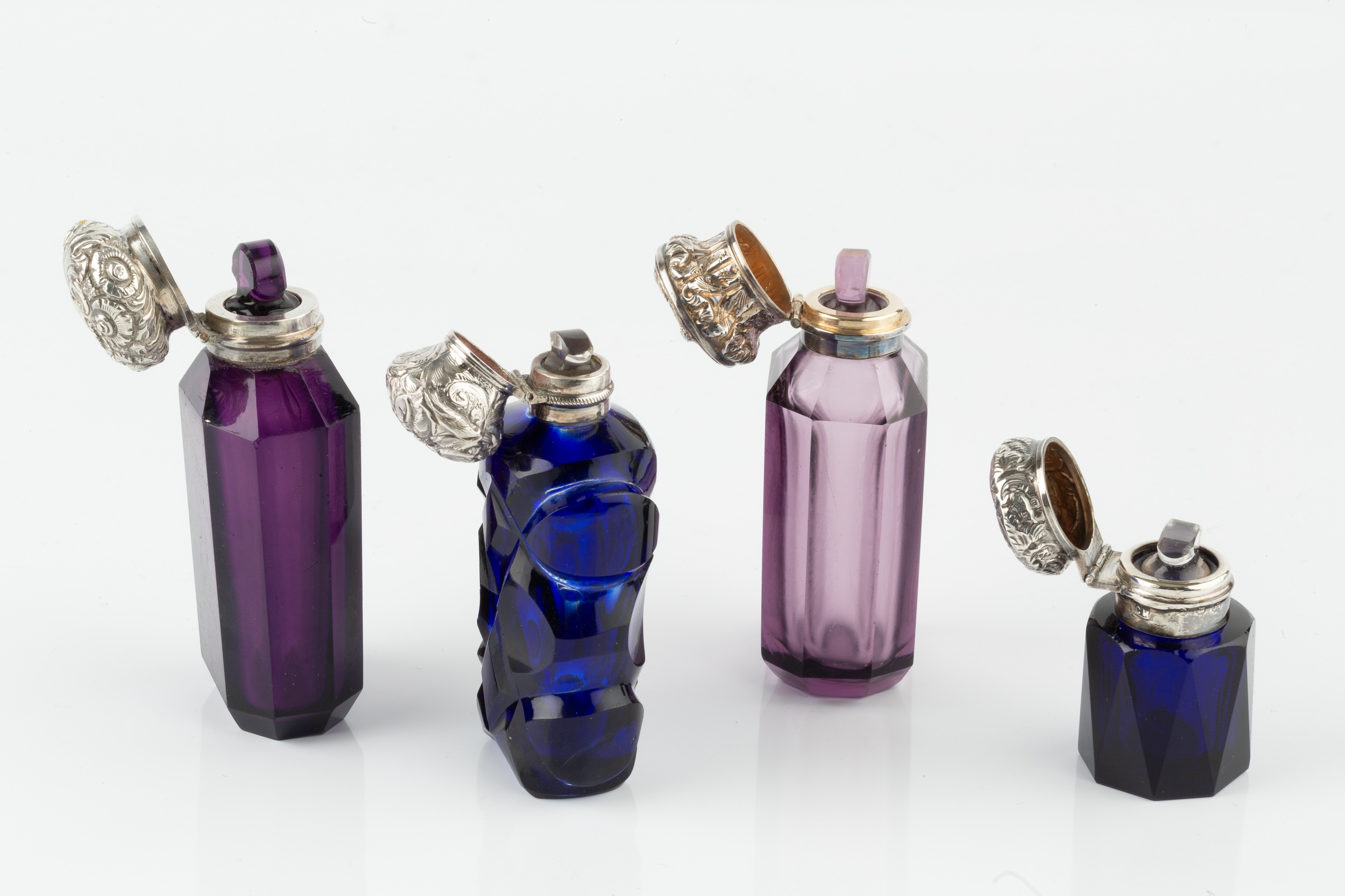 A 19th century Continental silver topped amethyst glass scent bottle, of faceted form, the hinged - Image 2 of 2