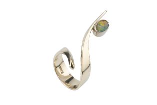 A modernist opal set ring by Frank Ahm, of flowing open spiral design from a single piece of wrought