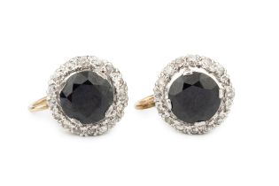 A pair of sapphire and diamond ear clips of cluster design, each with central circular sapphire