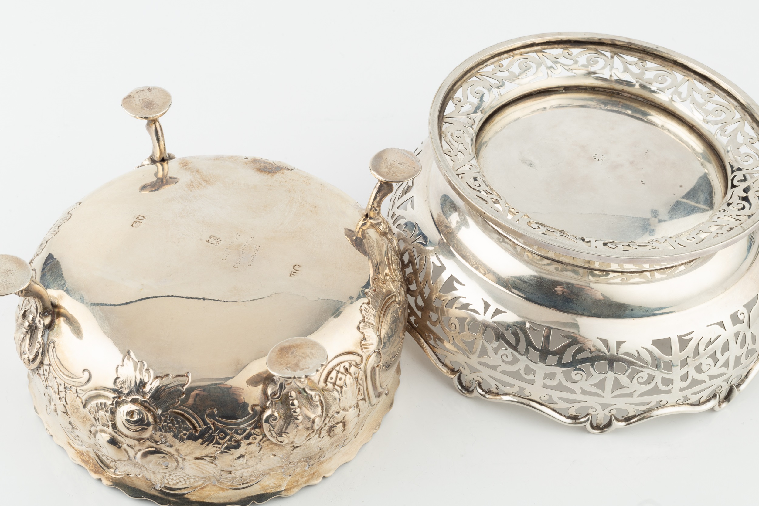 A late Victorian silver bowl, embossed and engraved with flowering foliage, on shaped legs with lily - Image 2 of 3