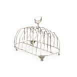 A George III silver nine bar toast rack, the angular wirework divisions with central handle, on